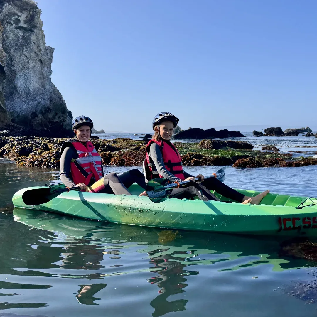 Family kayaking the calm Avila Beach estuary